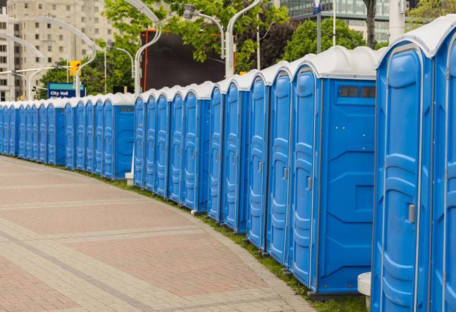 a row of portable restrooms at a trade show, catering to visitors with a professional and comfortable experience in Audubon